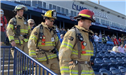 Firefighters walking down stadium stairs