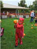 A child in costume with a pumpkin